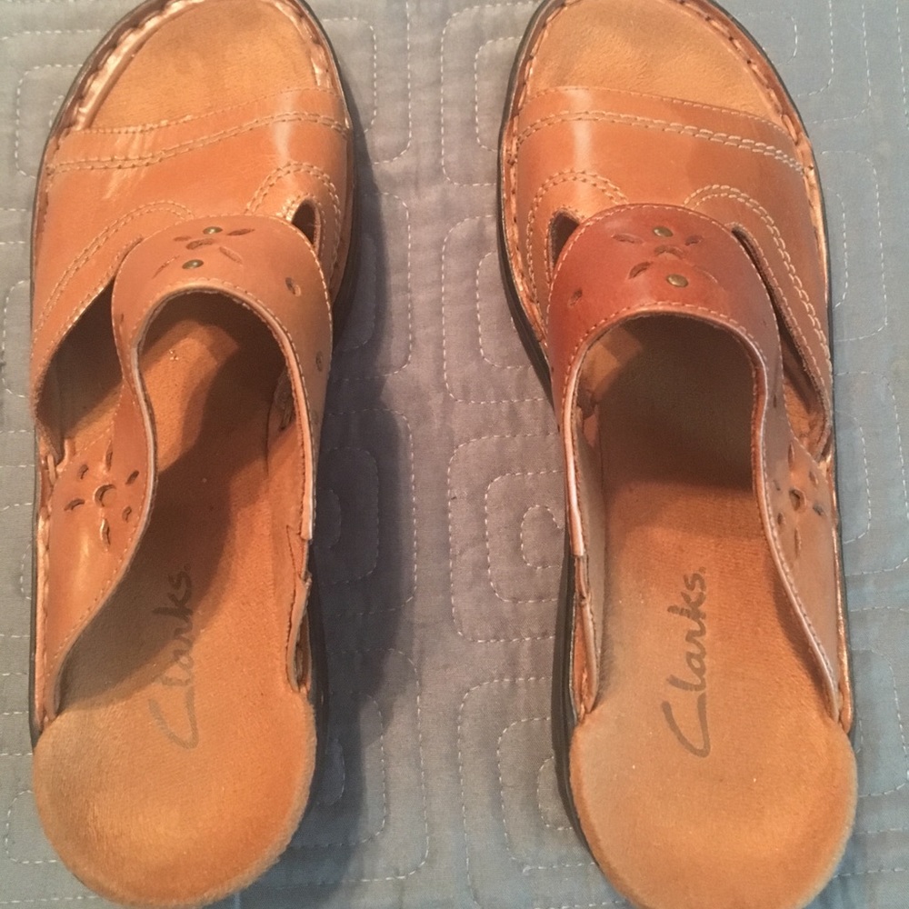 Clarks brown slip on sandals.